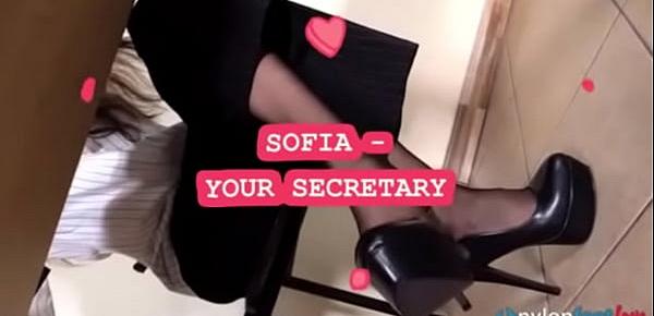  Secretary takes off heels and shows feet in black nylons